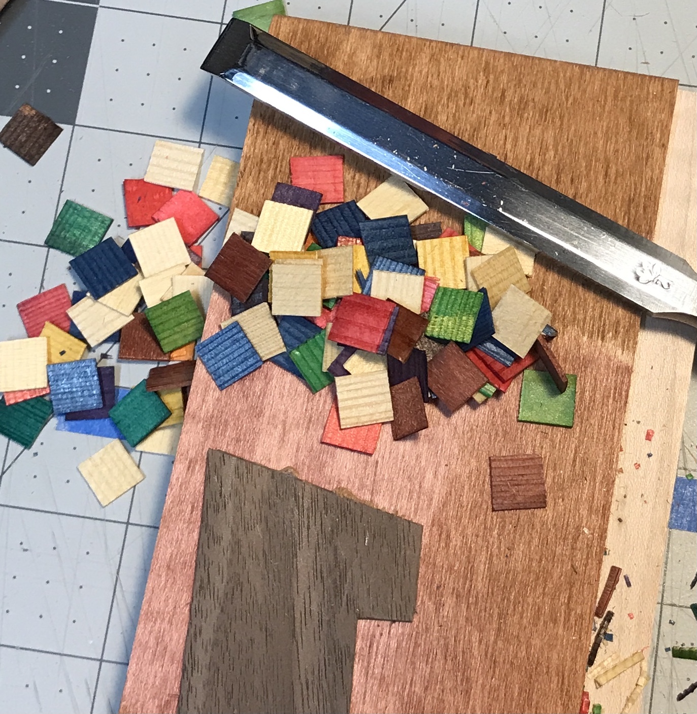 The colored squares cut to size with the chisel.